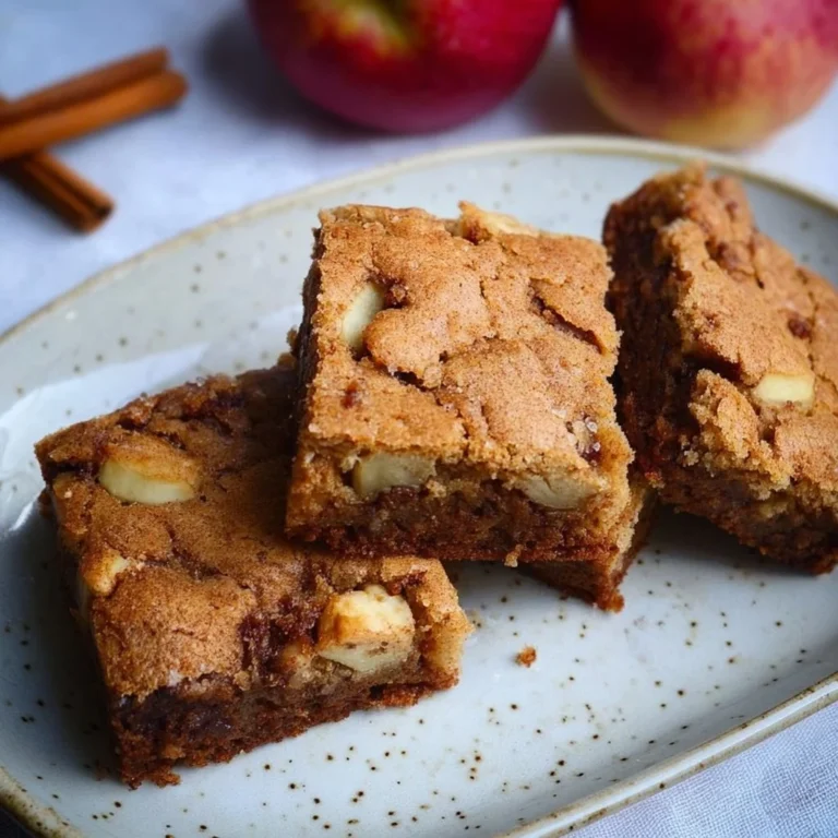 Delicious homemade apple brownies topped with nuts and drizzled with caramel.