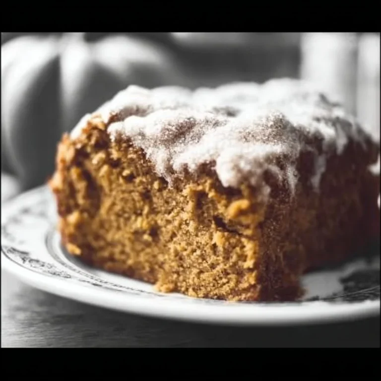 Delicious slice of pumpkin coffee cake topped with streusel and served on a plate.